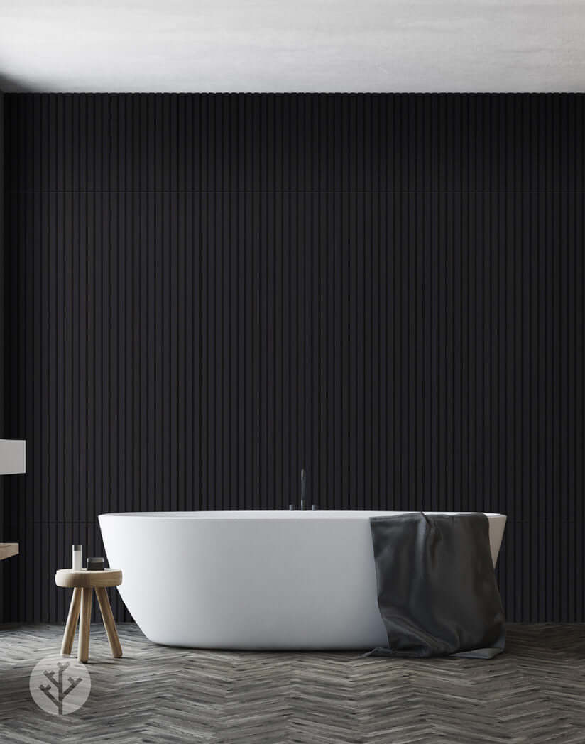 Luxurious bathroom with black acoustic slat wall panels, modern bathtub, and stylish interior wall panelling.