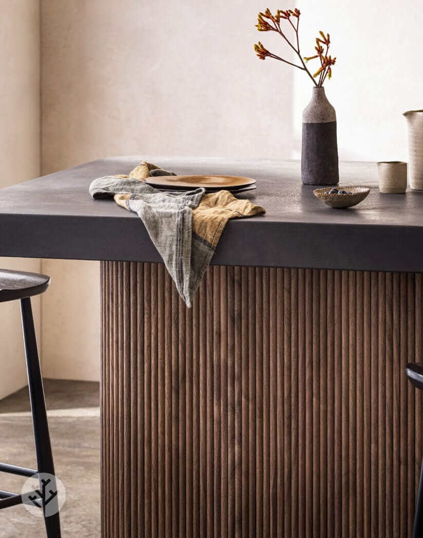 Walnut Mini-Ridge flexible tambour wood panels on a modern kitchen island with decor accents.