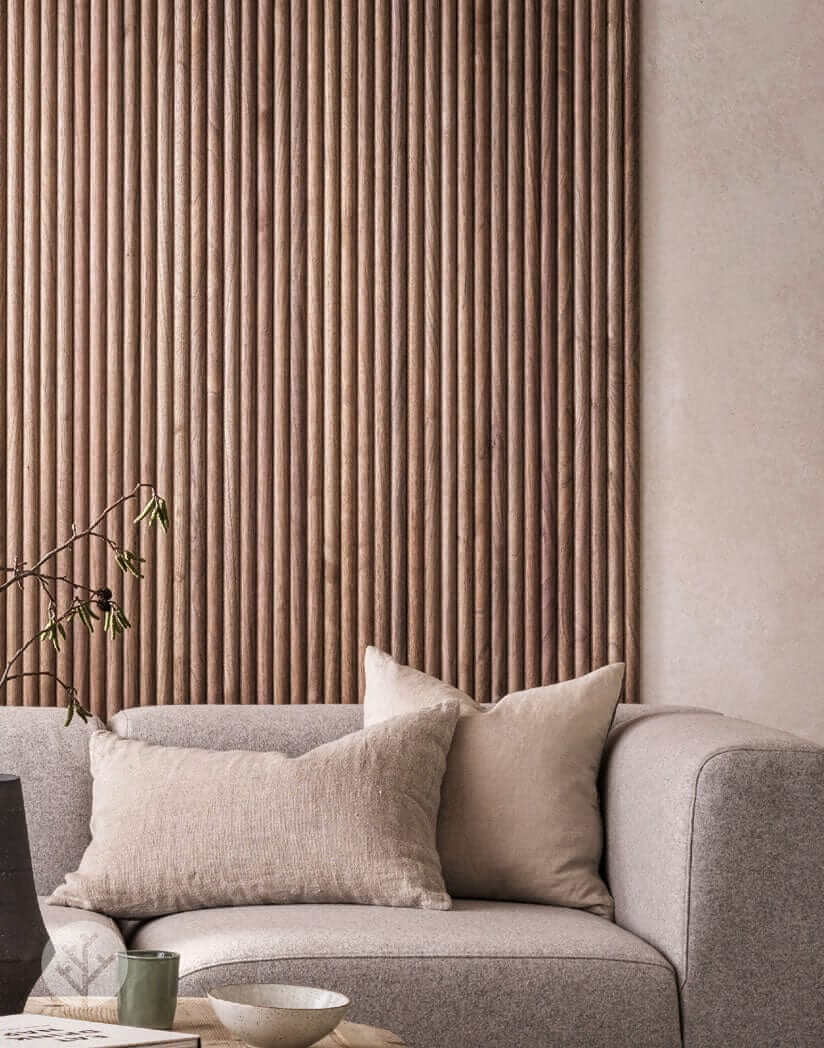 Luxury wall panels in walnut finish add elegance to modern living room with gray sofa and neutral decor.