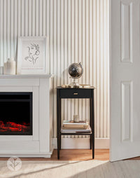 Interior with Snow White Acoustic Slat Wall Panels enhancing modern decor, featuring a sleek fireplace and elegant side table.