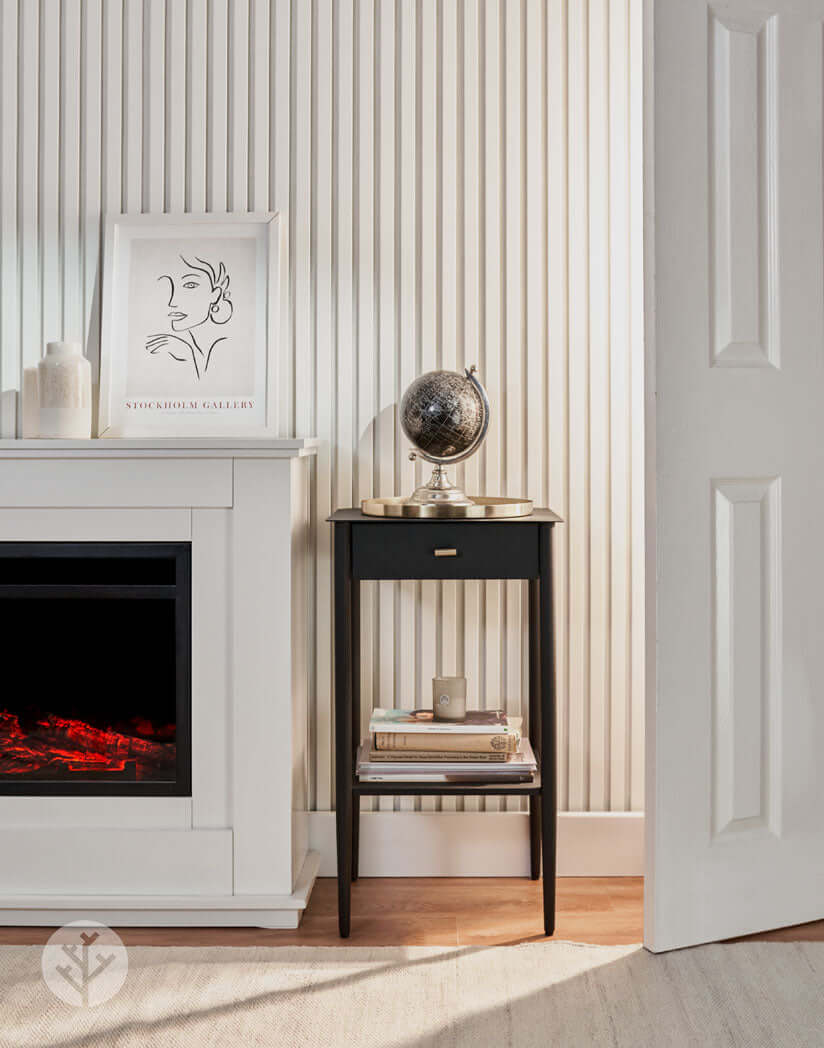 Interior with Snow White Acoustic Slat Wall Panels enhancing modern decor, featuring a sleek fireplace and elegant side table.
