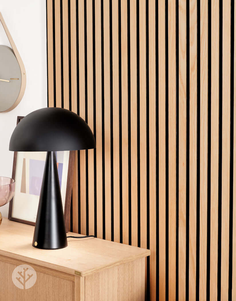 Natural Oak Acoustic Slat Wood Wall Panels with modern black lamp, enhancing interior wall panelling and sound quality.