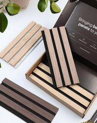 Acoustic slat wood wall panels sample box showcasing various wood finishes for interior design and wall panelling.