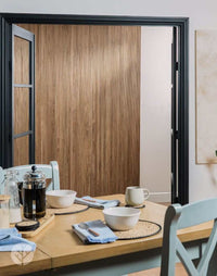 Dining area featuring Walnut Mini-Ridge Flexible Tambour Wood Panels as a stylish wall accent.
