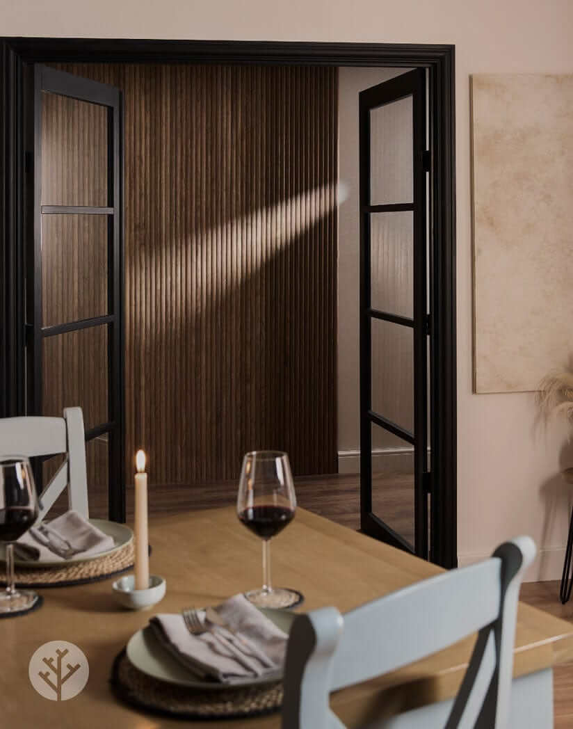 Dining room featuring Walnut Ridge Flexible Tambour luxury wall panels and elegant table setting with wine glasses.