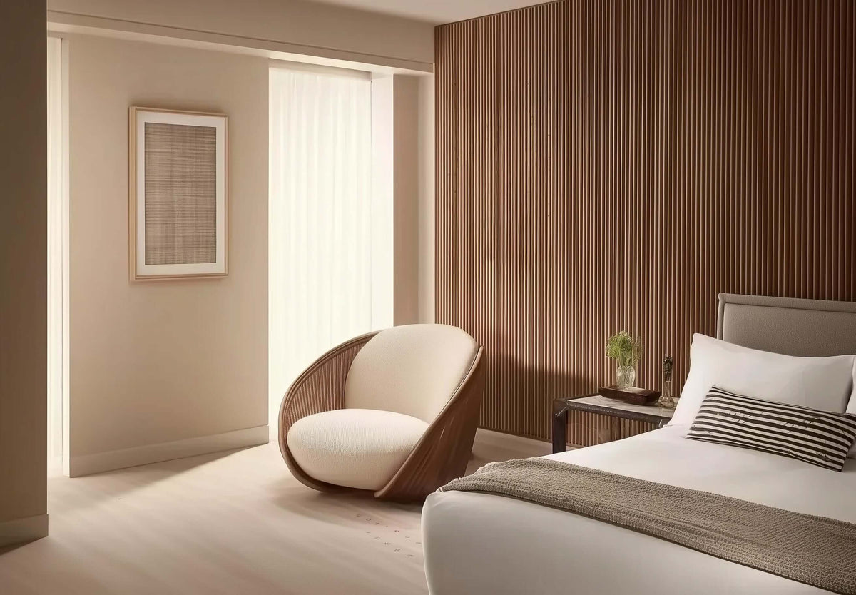 Minimalist bedroom with cozy chair, wooden accent wall, and soft natural lighting.
