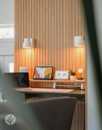 Natural Oak Grey Felt Acoustic Slat Wood Wall Panels in interior office setting with modern decor.